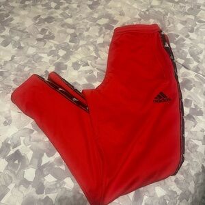 Red adidas track pants